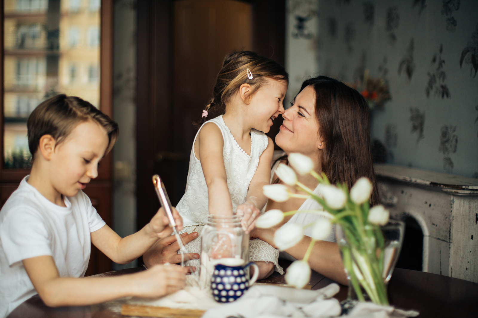 A mother and her children spending time together in their air conditioned home