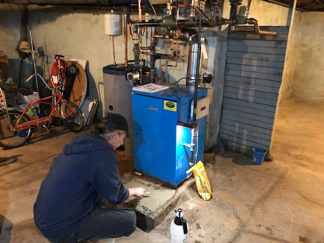 Chester County Fuel Oil technician performing an annual tune up for a customer 