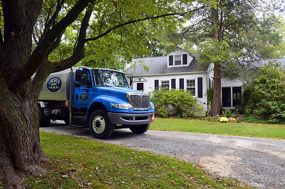 Chester County Fuel Oil truck in front of a home 