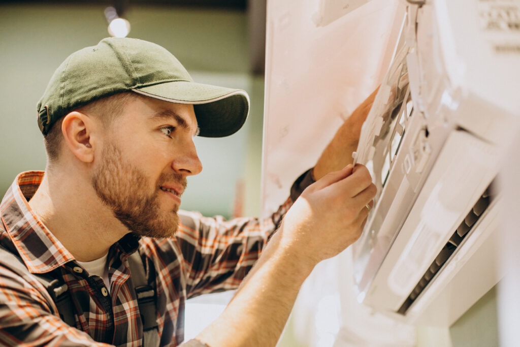 An image of a repair man working air filters